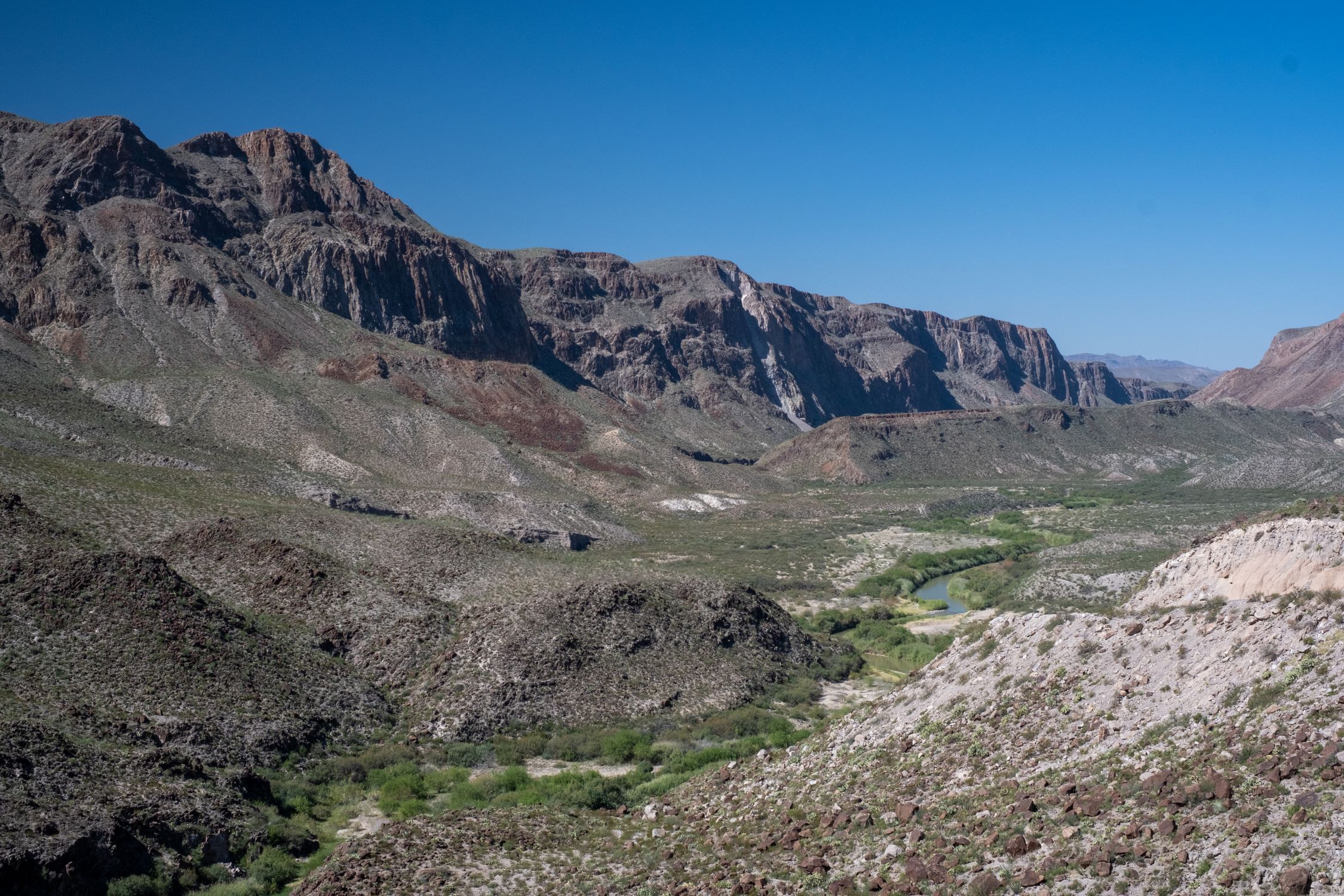 Explore the breathtaking landscape of Terlingua Valley, Texas with dramatic rocky mountains.