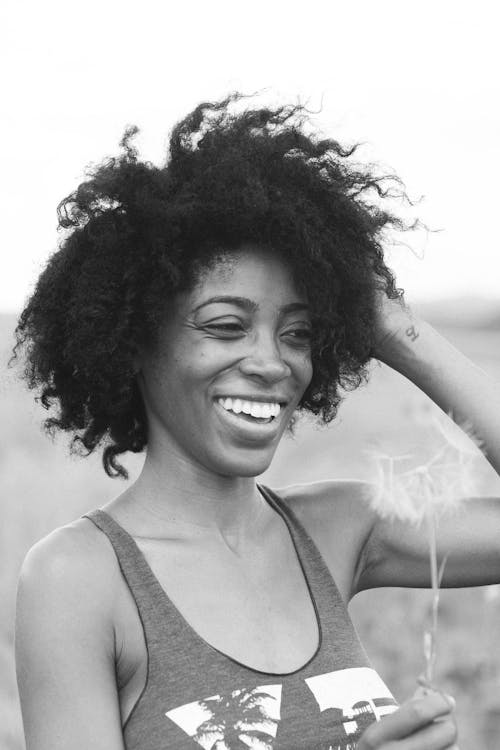 Free Grayscale Photo of Smiling Woman in Tank Top Stock Photo