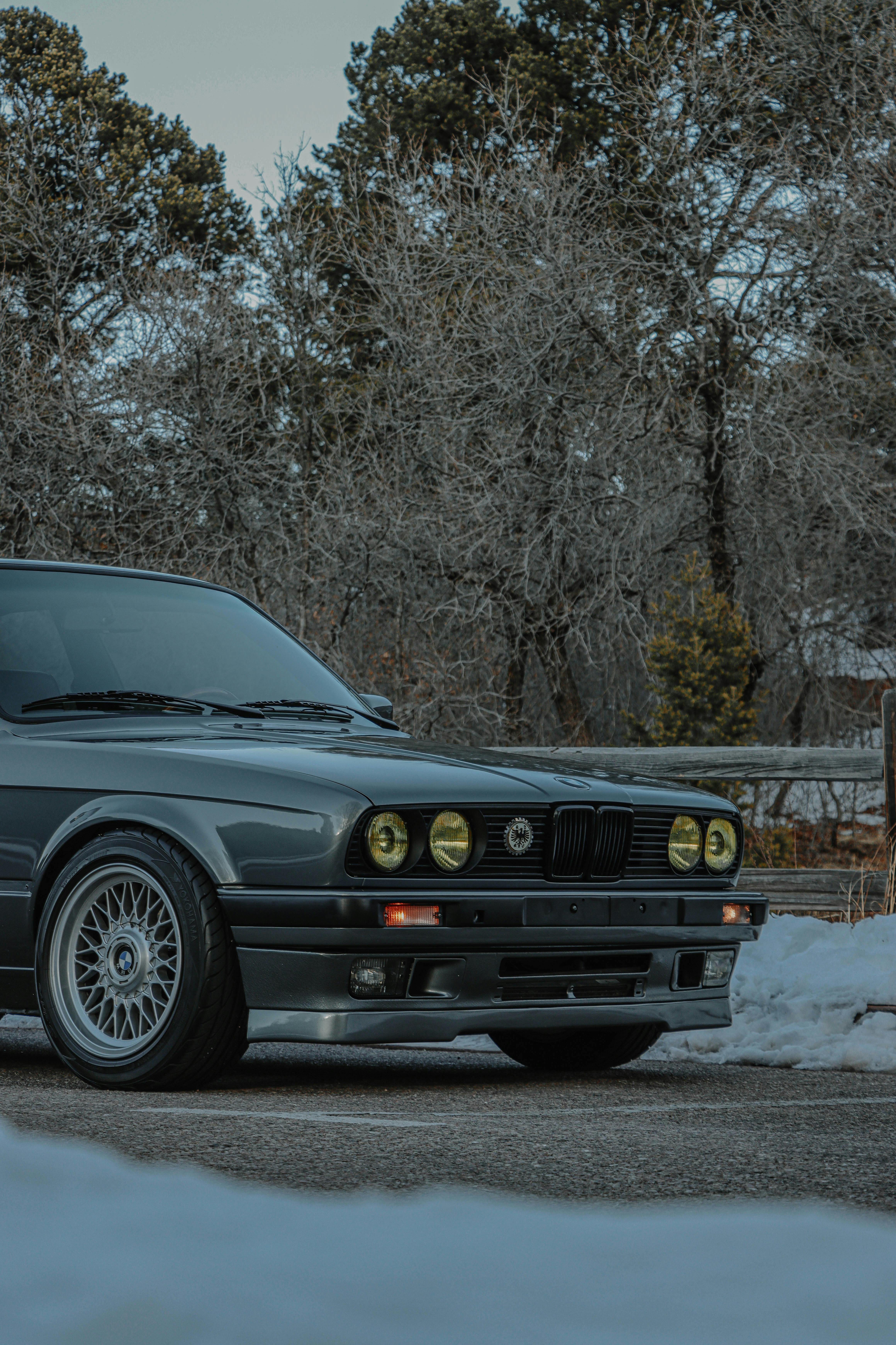 BMW E60 Parked on Grey Concrete Road · Free Stock Photo