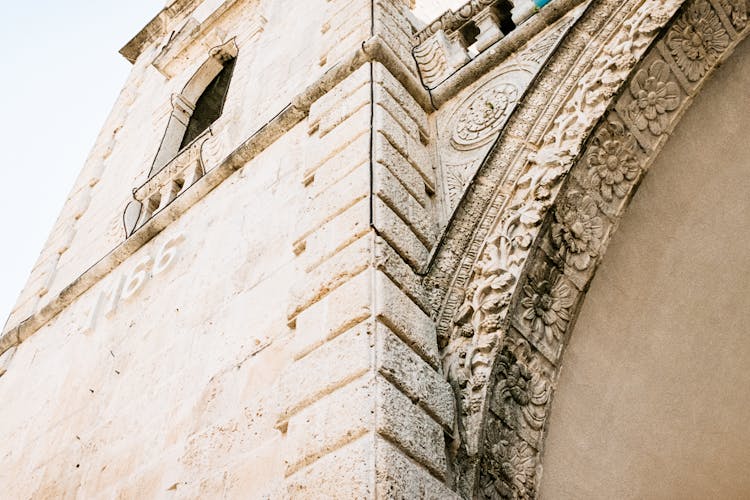 Low Angle View Of Reliefs On Arch Of Renaissance Building