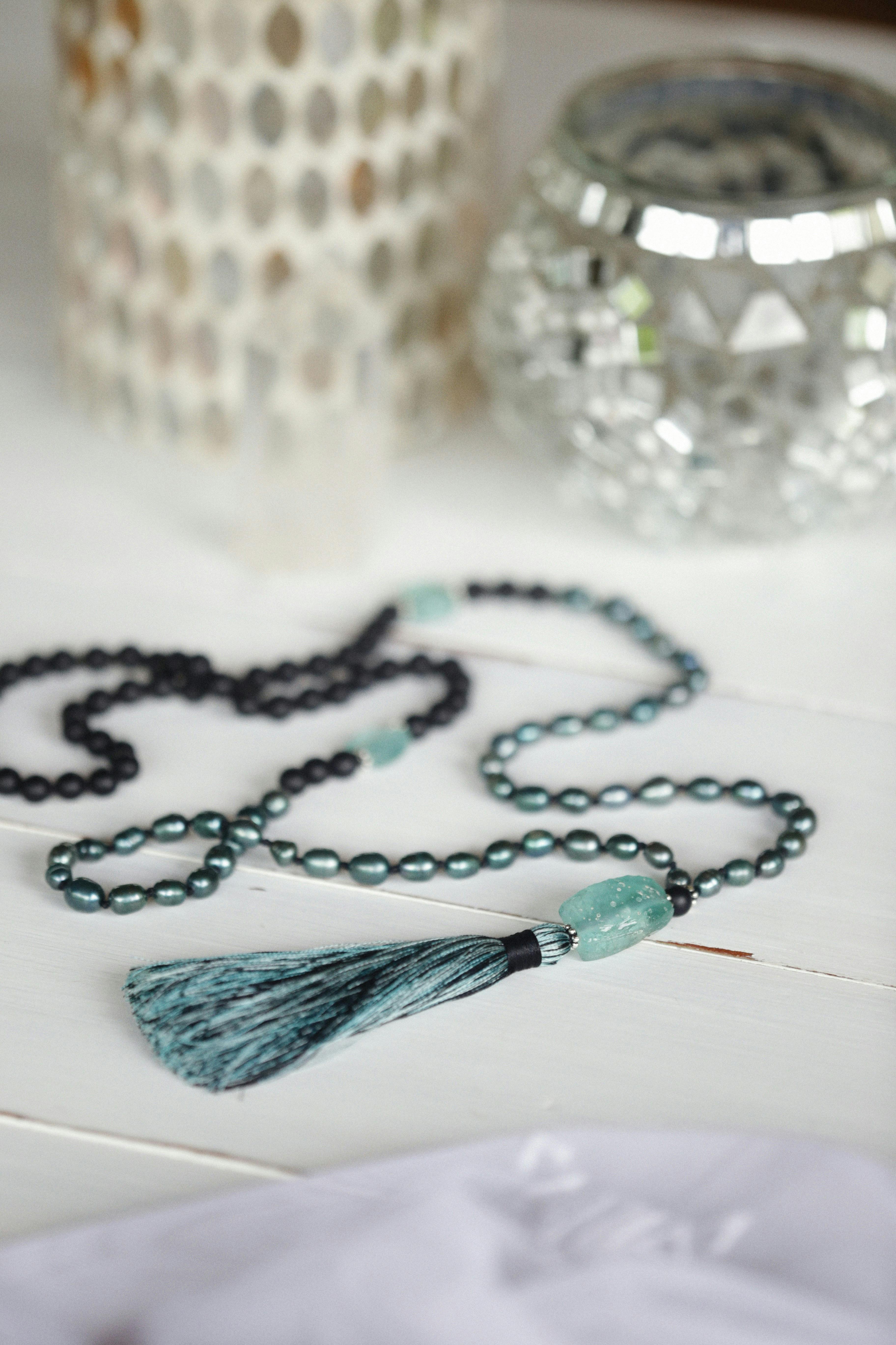 Colorful Tassels and Confetti on White Surface · Free Stock Photo