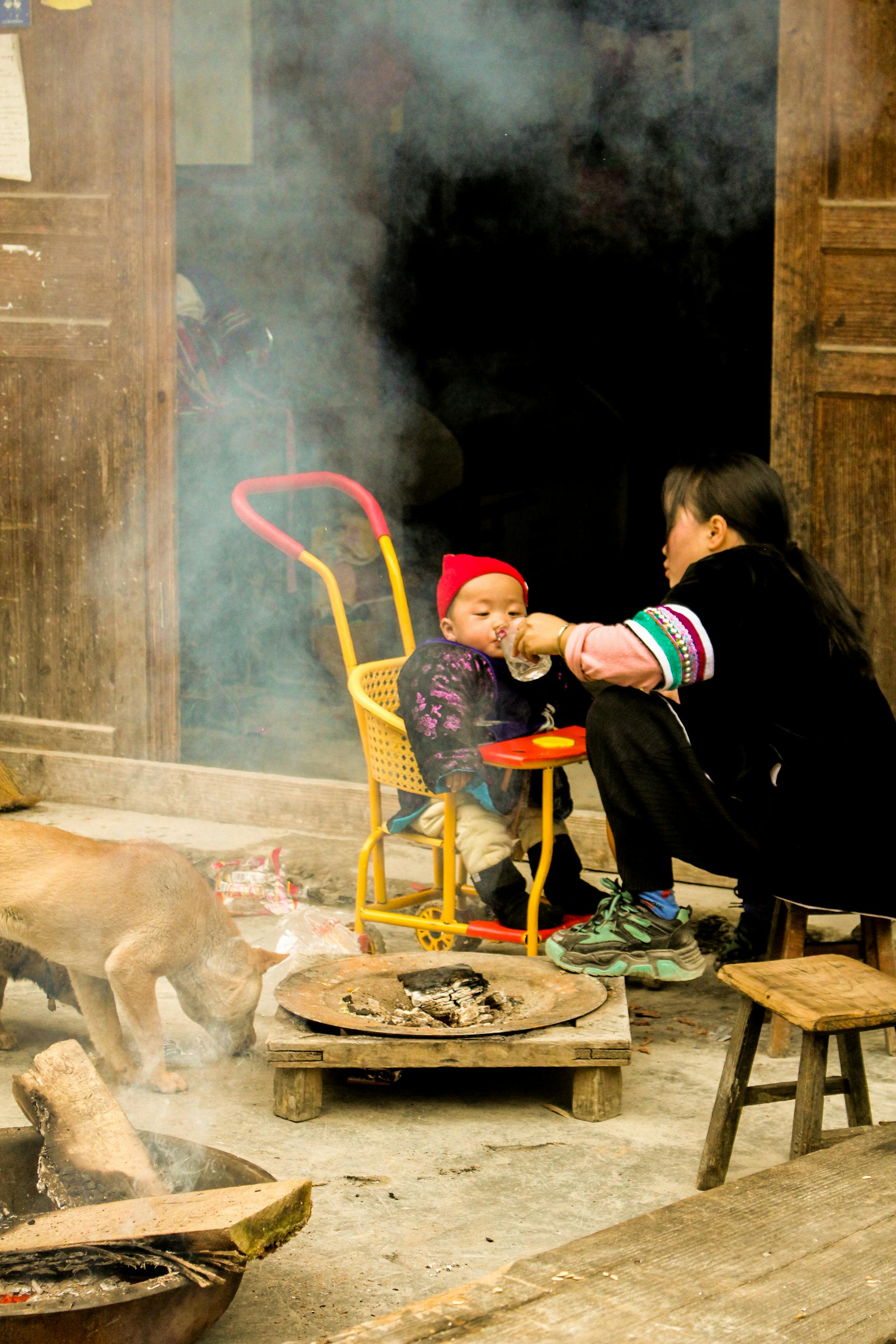 mother sitting and feeding baby