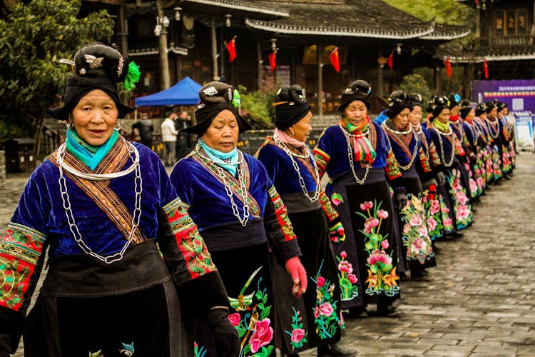 Miao Women In Traditional Clothes Standing In Line