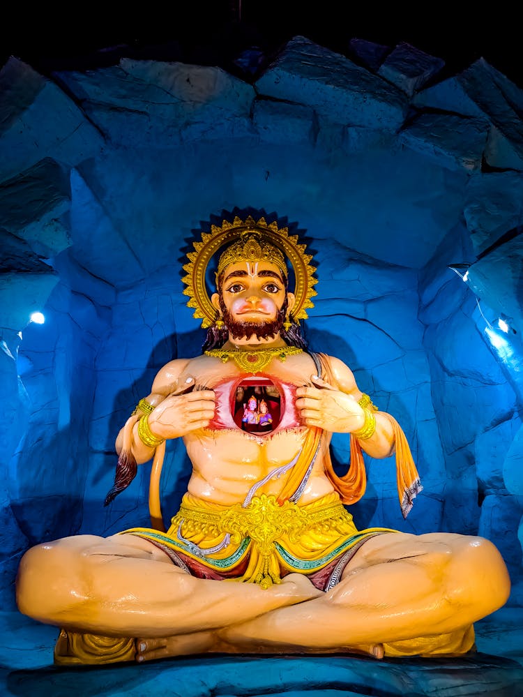 A Statue Of Hanuman Tearing His Chest