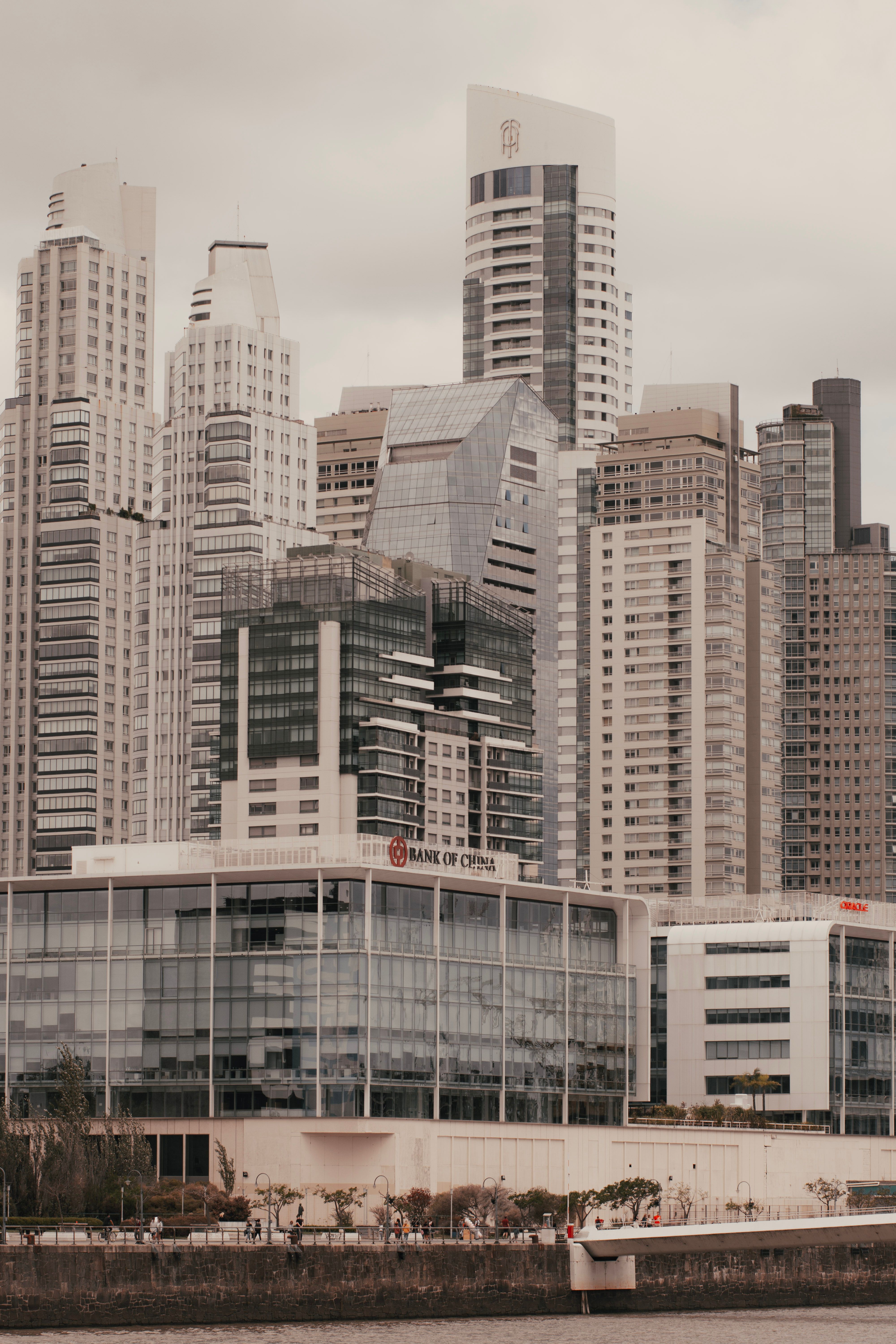 Photo of a Bank Near High-Rise Buildings · Free Stock Photo