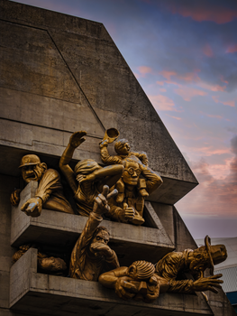Abstract sculpture on a Canadian building at dusk, showcasing modern art and architectural harmony.