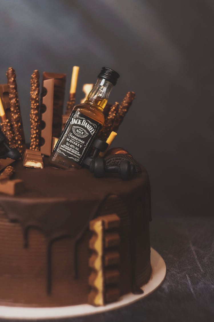 A Chocolate Cake With A Bottle