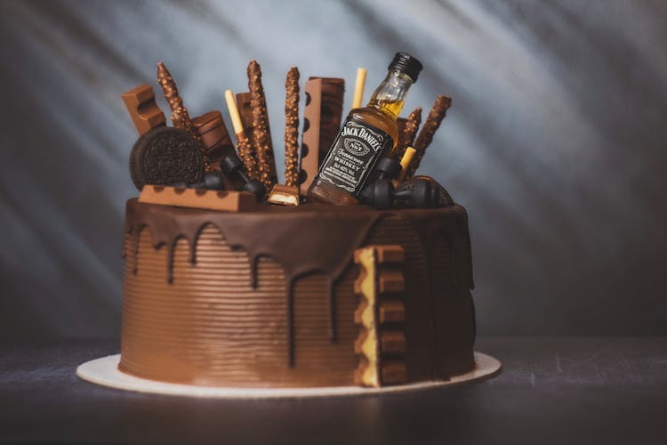 A Small Bottle Of Jack Daniel's On A Chocolate Cake