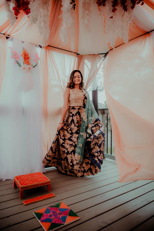 Photograph of a Bride Standing on a Wooden Floor