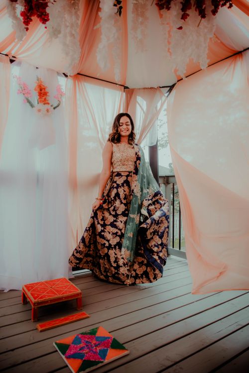 Free Beautiful Indian bride in a traditional wedding dress, indoors with vibrant decorations. Stock Photo