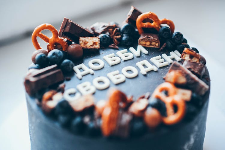 Close-Up Photo Of A Cake With Cyrillic Text