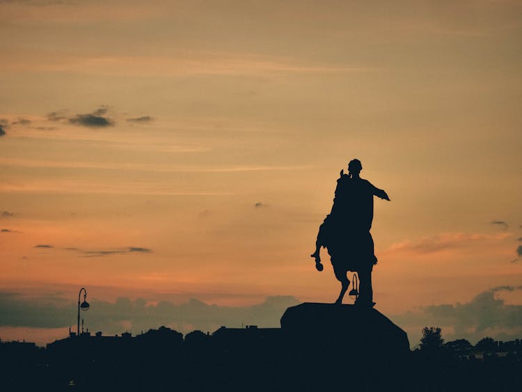 Silhouette Of A Man Riding A Horse 