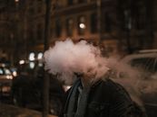 Man in Black Jacket Smoking