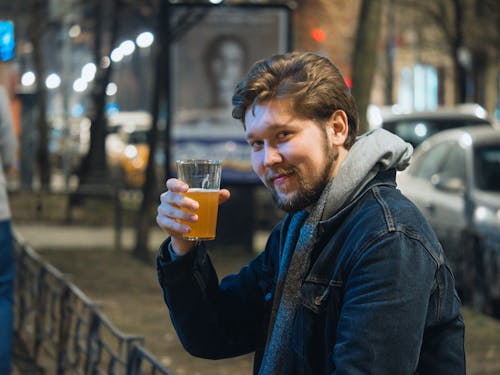Free Photo of a Man with a Beard Holding a Glass of Beer Stock Photo