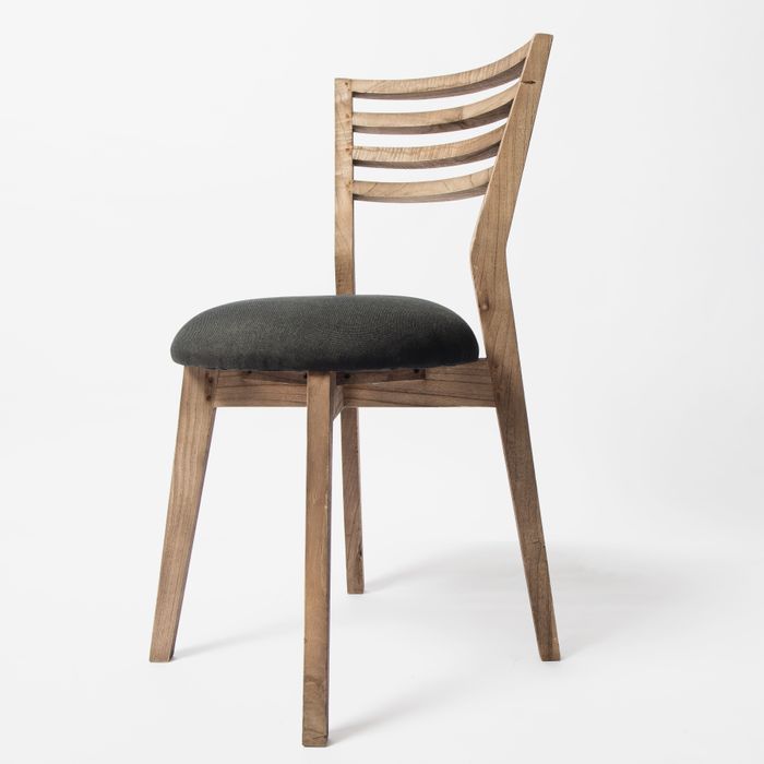 Wooden dining chair with a cushioned seat on white, photo by Ksenia Chernaya on Pexels