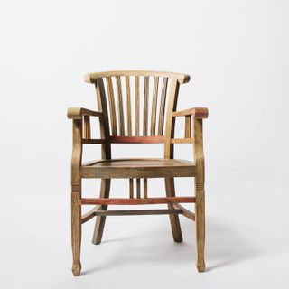 Wooden armchair with a slatted back on a white background, photo by Ksenia Chernaya on Pexels