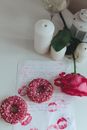 Pink and White Floral Doughnut on White Paper