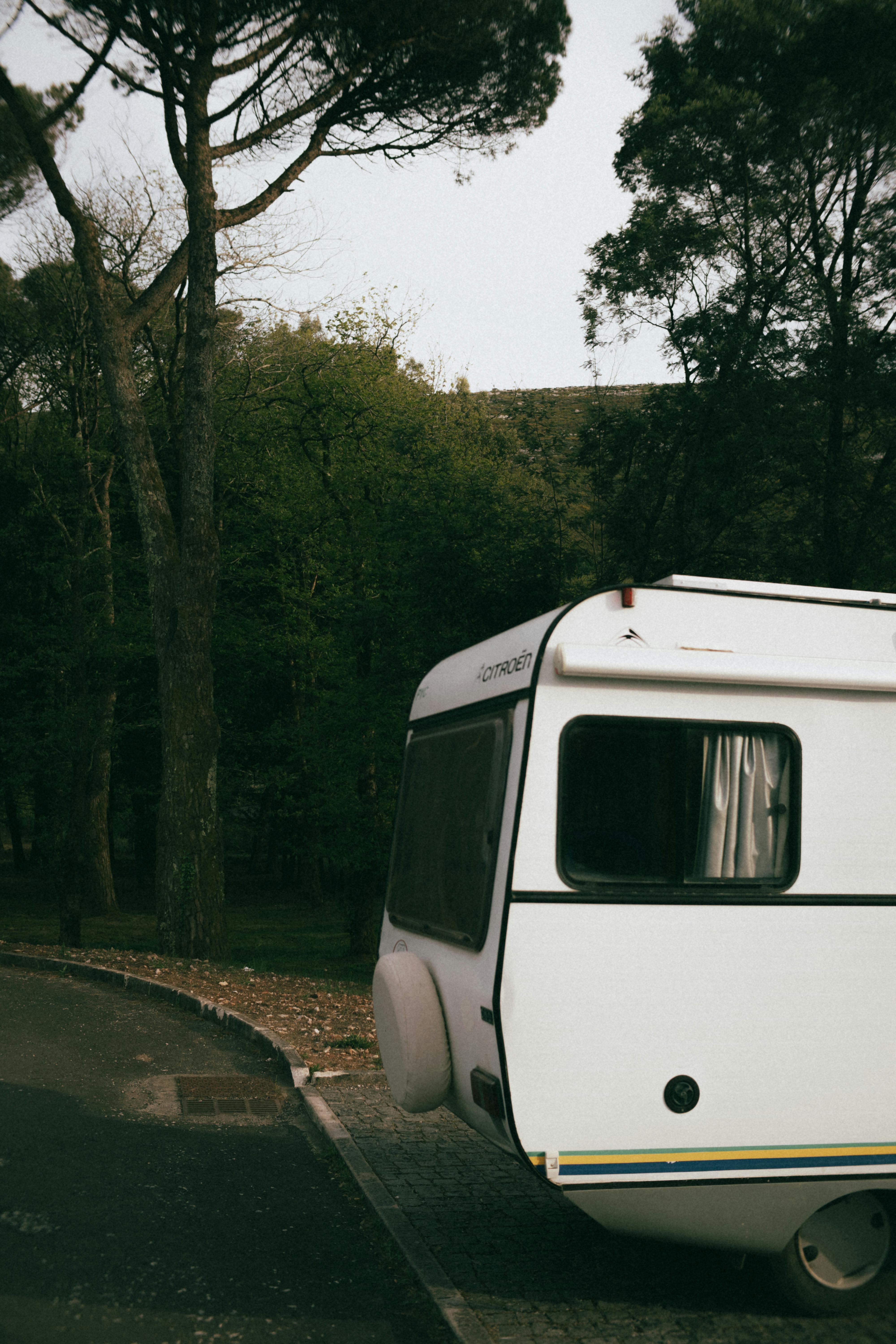 Caravan Parked on Sidewalk Free Stock Photo