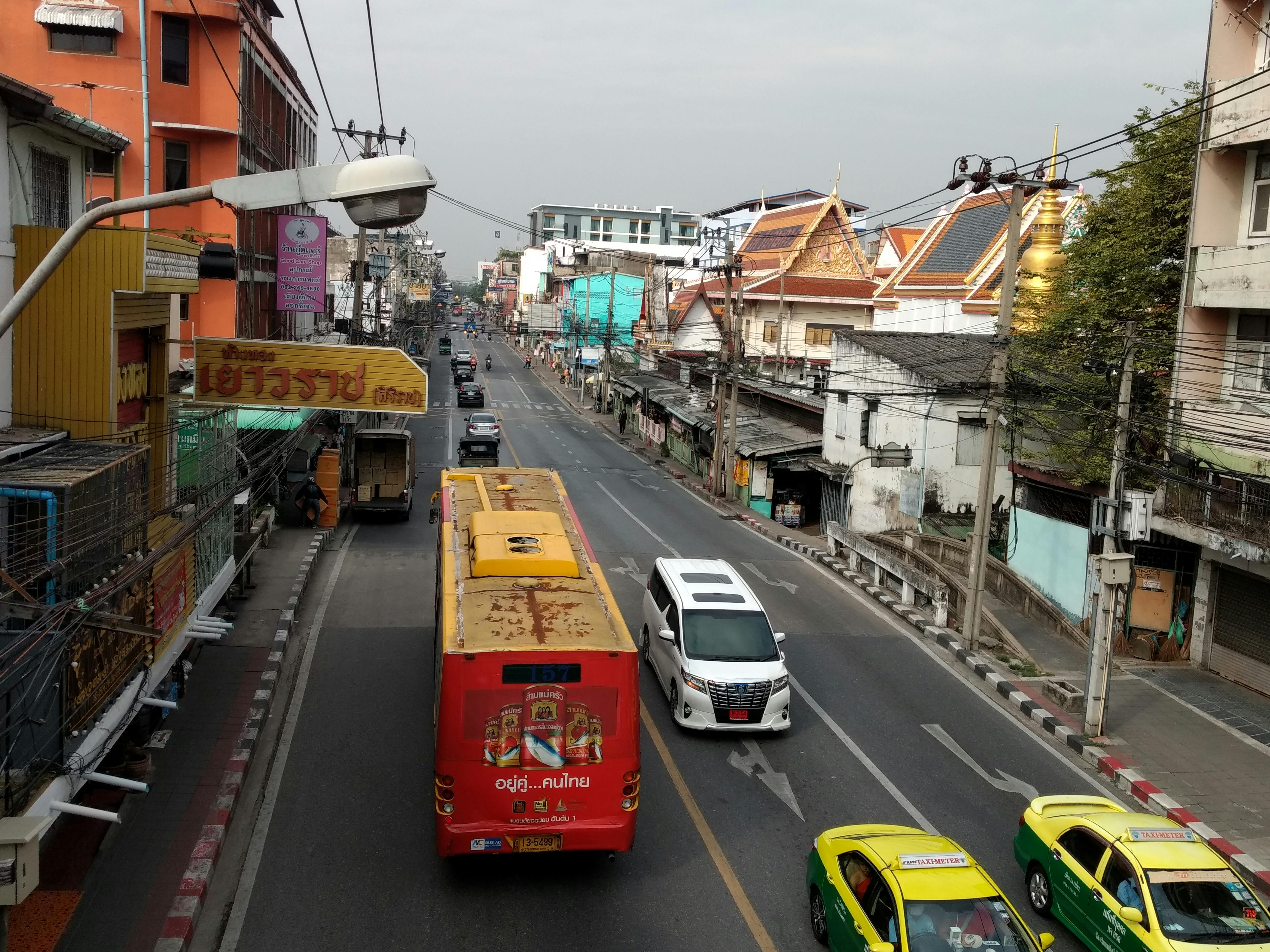 Organic coconut oil in a jar and coconut on a wooden surface