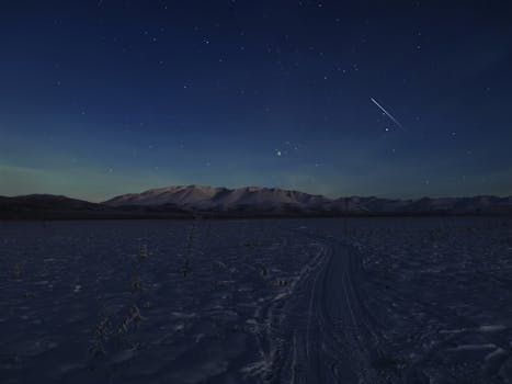 Stunning starry night sky over snowy mountains near Yakutsk, Russia.