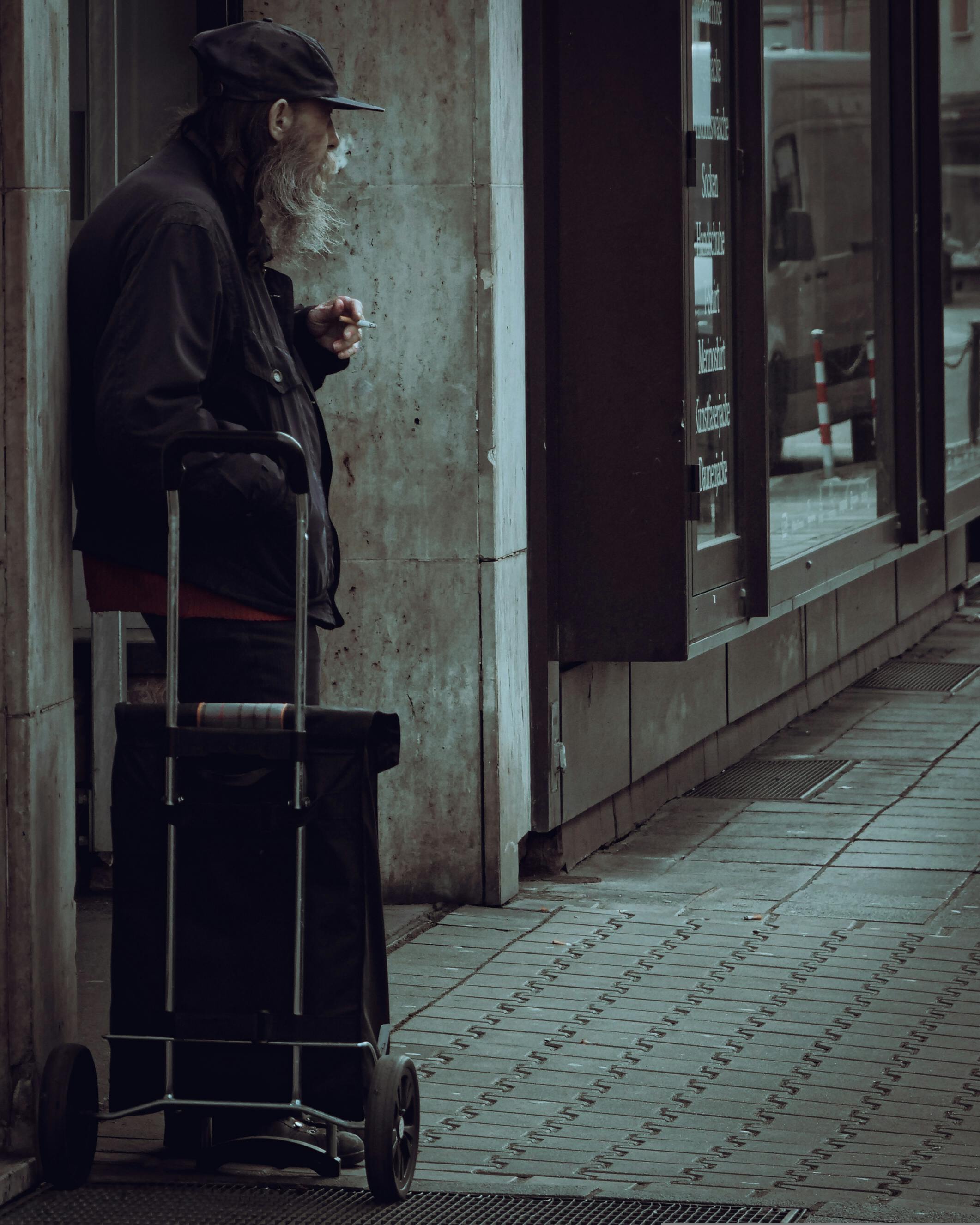 man smoking on street