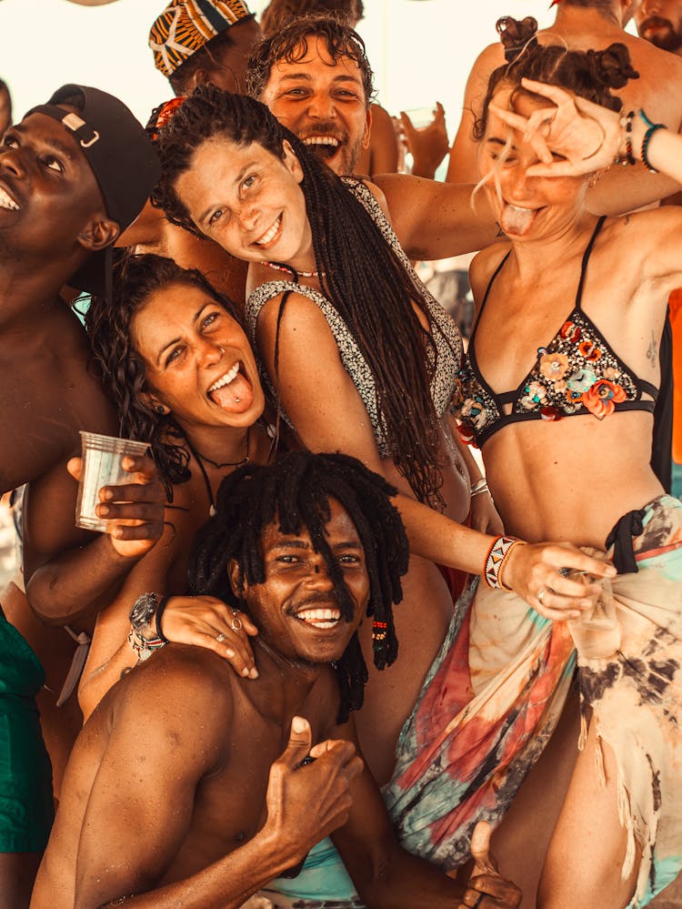 Group Of People In Swimsuits Partying