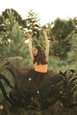 Teenage Girl Dancing in Tall Grass