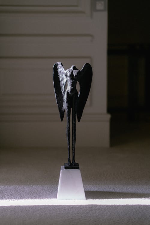 Headless Angel Statue on Display in Museum