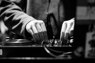 Person in Gray Long Sleeve Shirt Playing Dj Mixer