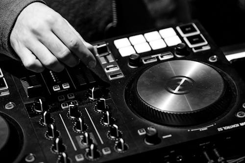 Free A Person Using a DJ Mixer Stock Photo
