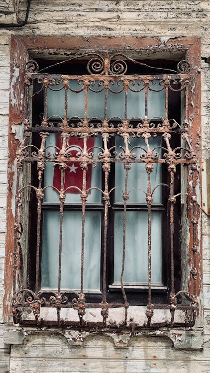 Metal Grill of a Framed Glass Window