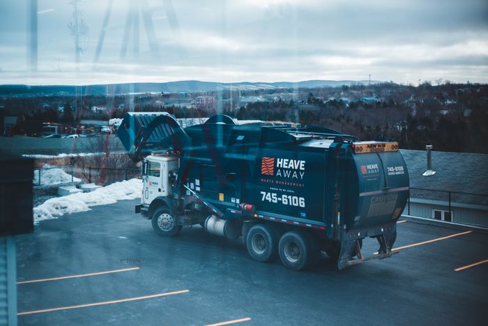 Waste collection truck on a residential street