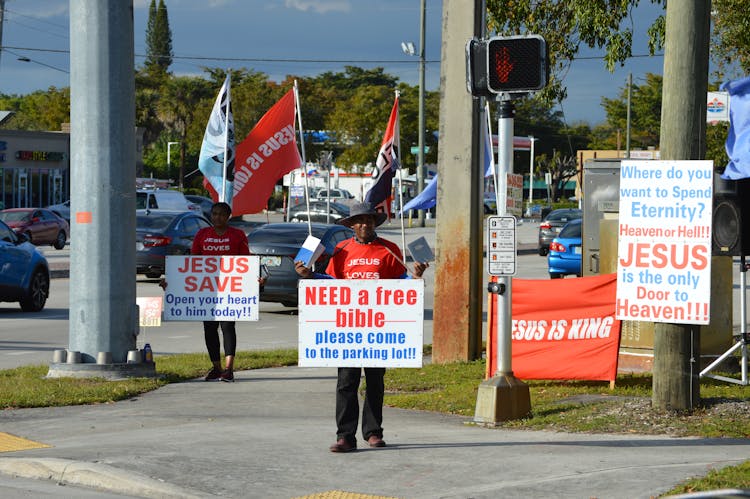 People With Signs In A City