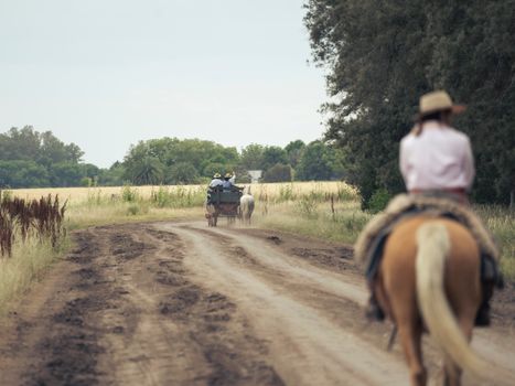 Man Riding Horse on Dirt Road