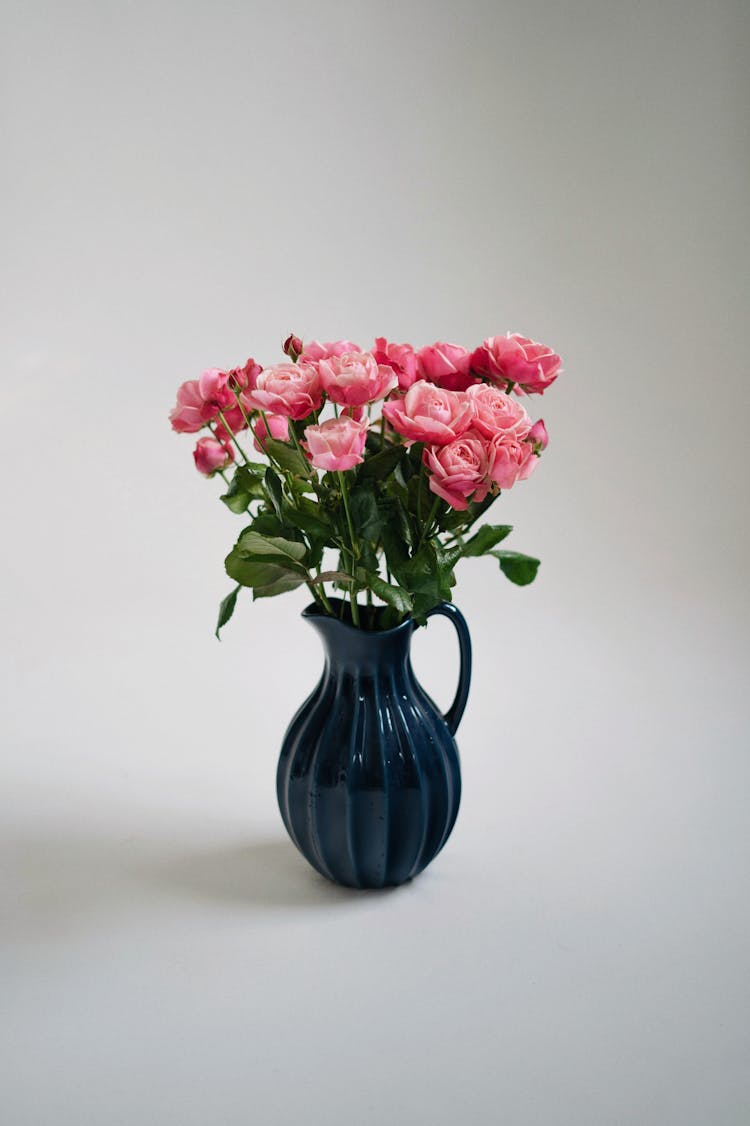 Bouquet Of Pink Roses In Blue Vase