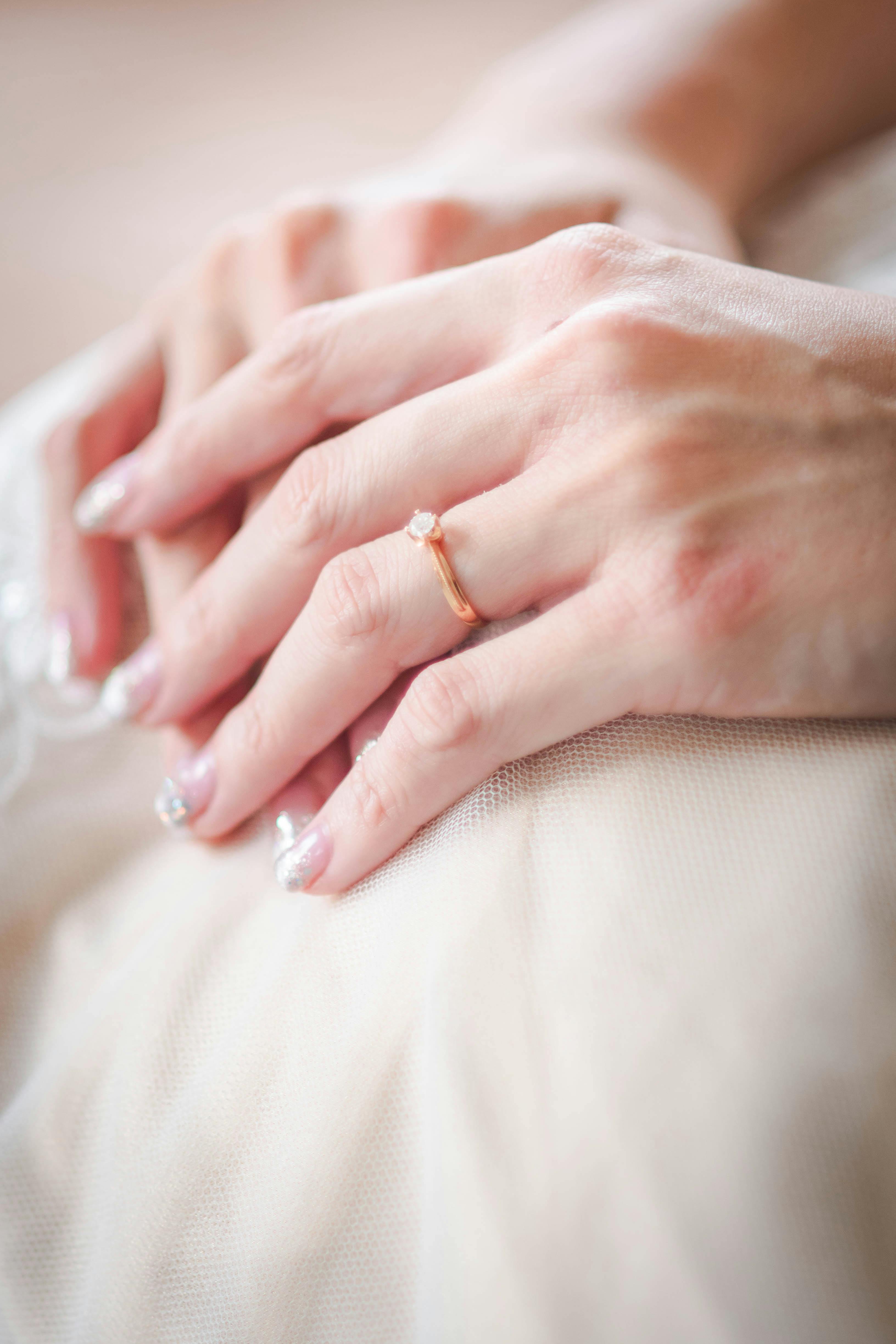 close up photo of a person with a ring