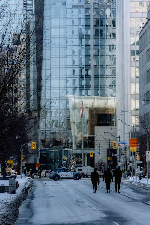 People Walking on a City Street in Winter