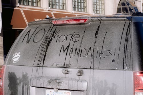 Political Message Written on a Frosted Car Window