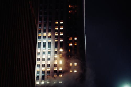 Free Illuminated Exterior of a Skyscraper at Night  Stock Photo