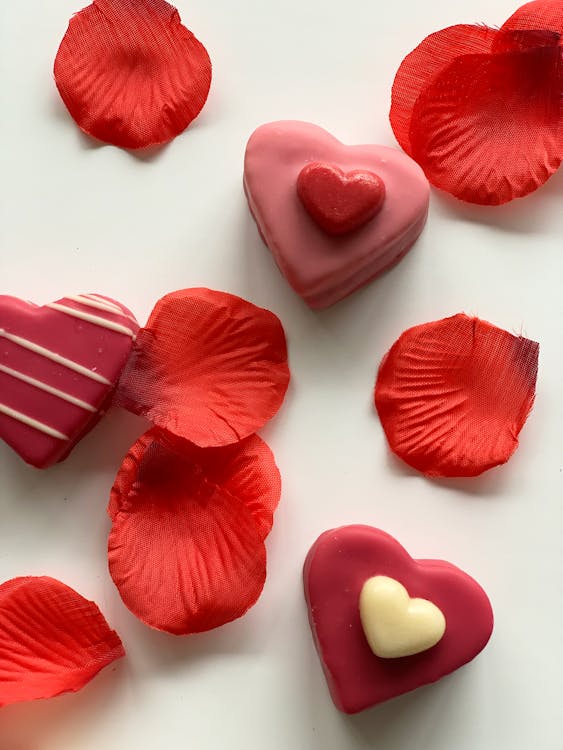 Free Rose Petals and Heart Shaped Sweets Stock Photo