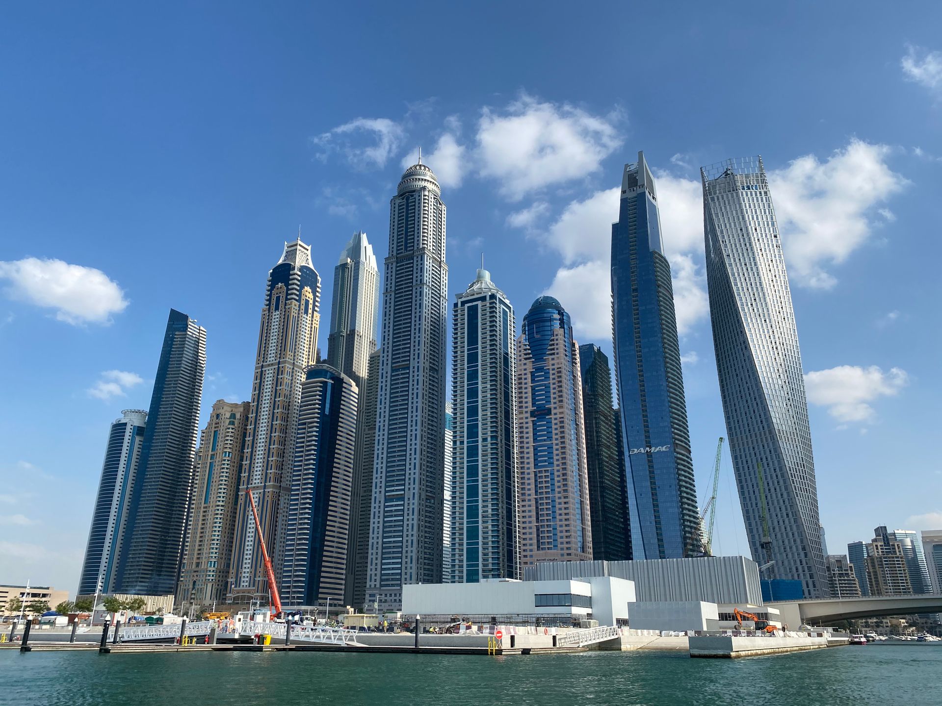 A breathtaking view of Dubai Marina's iconic skyscrapers under a clear blue sky, showcasing modern architecture.