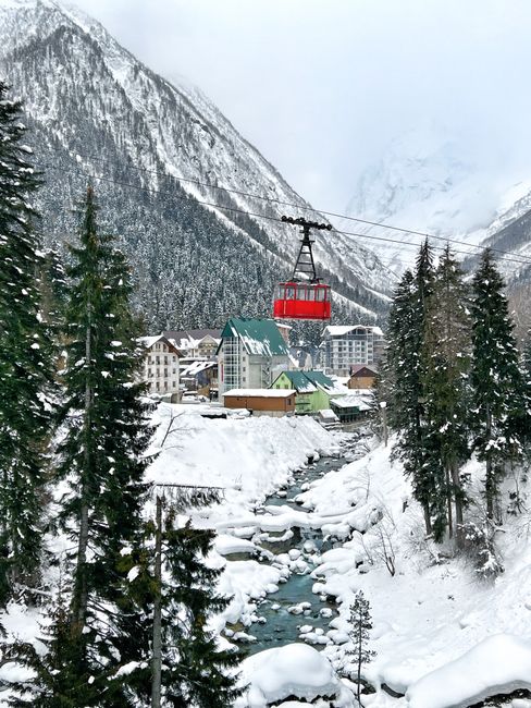 A general view of Shirar Resort & Spa buildings nestled in a lush green valley with towering Himalayan peaks in the background