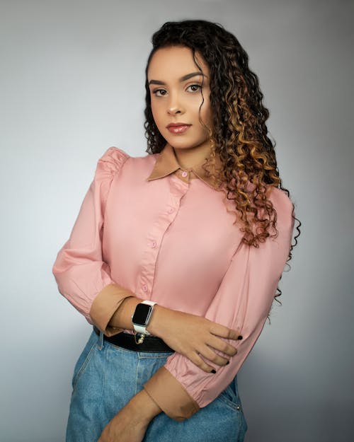 Studio Portrait of a Young Beautiful Woman With Curly Hair