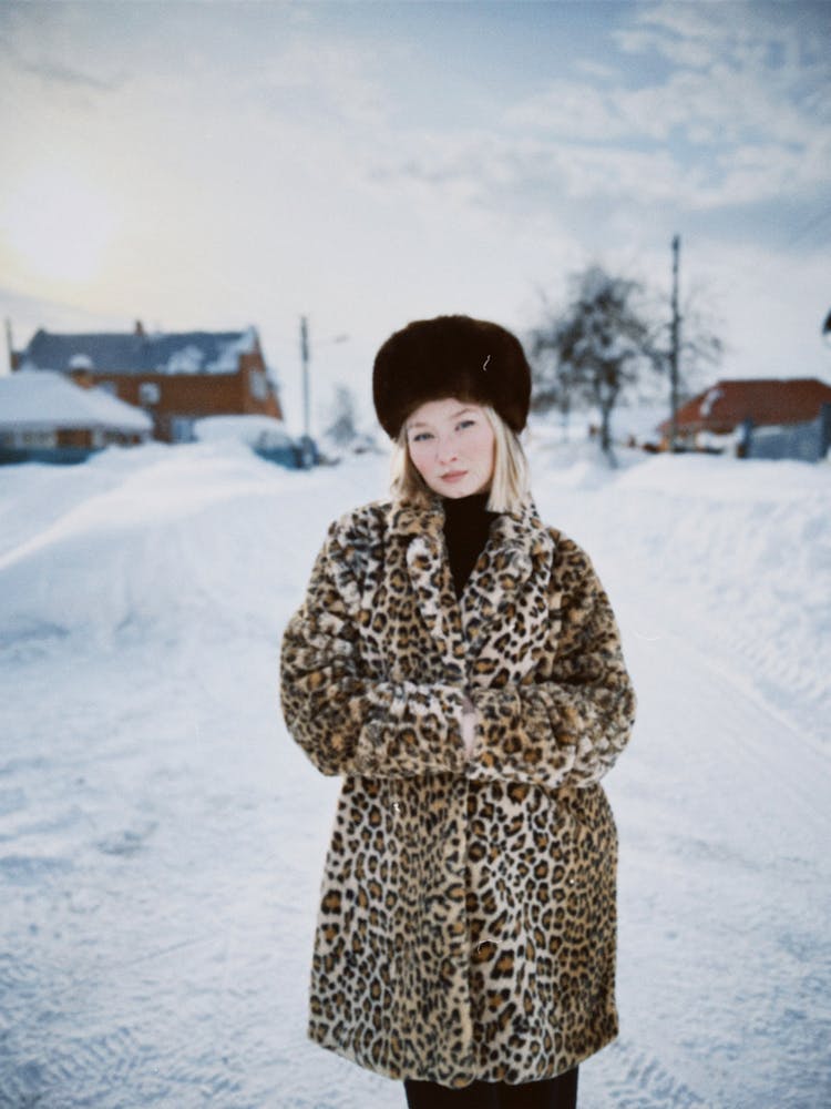 Blonde Woman In Fur Coat And Hat In Winter 