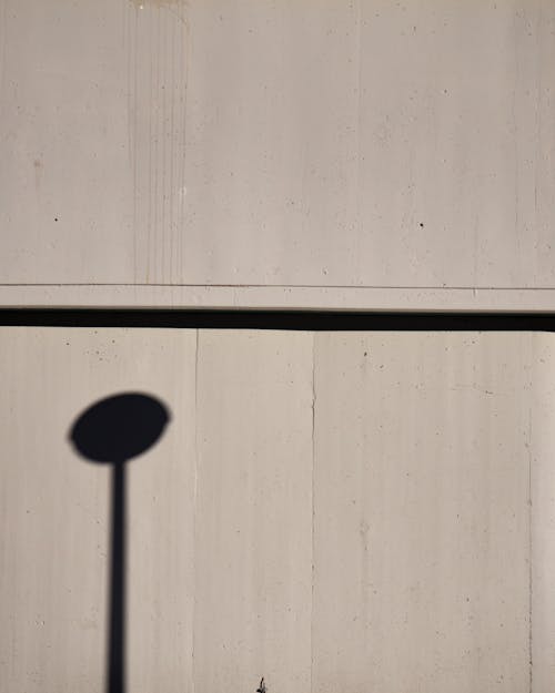 Lamp Post Shadow on the Concrete Wall