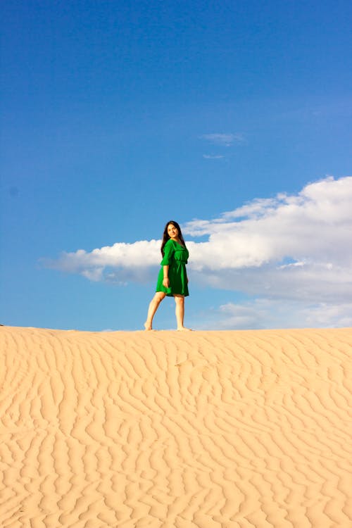 Woman in Green Dress in the Sand Dunes