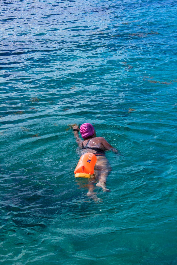 A Person Swimming In The Sea