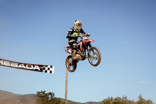 Free A Man Riding Motocross Dirt Bike Stock Photo