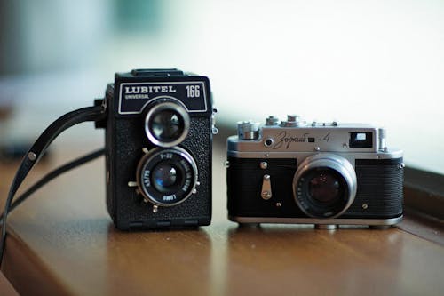 Free Vintage Cameras on Wooden Table Stock Photo