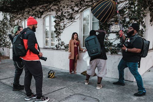 A Group of People Photo Shoot in the Street